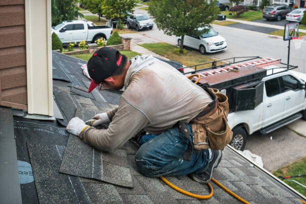 Professional Roof Replacement technician working in Westbury, NY